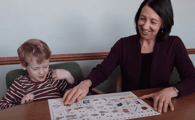 Cristianne working together with a student