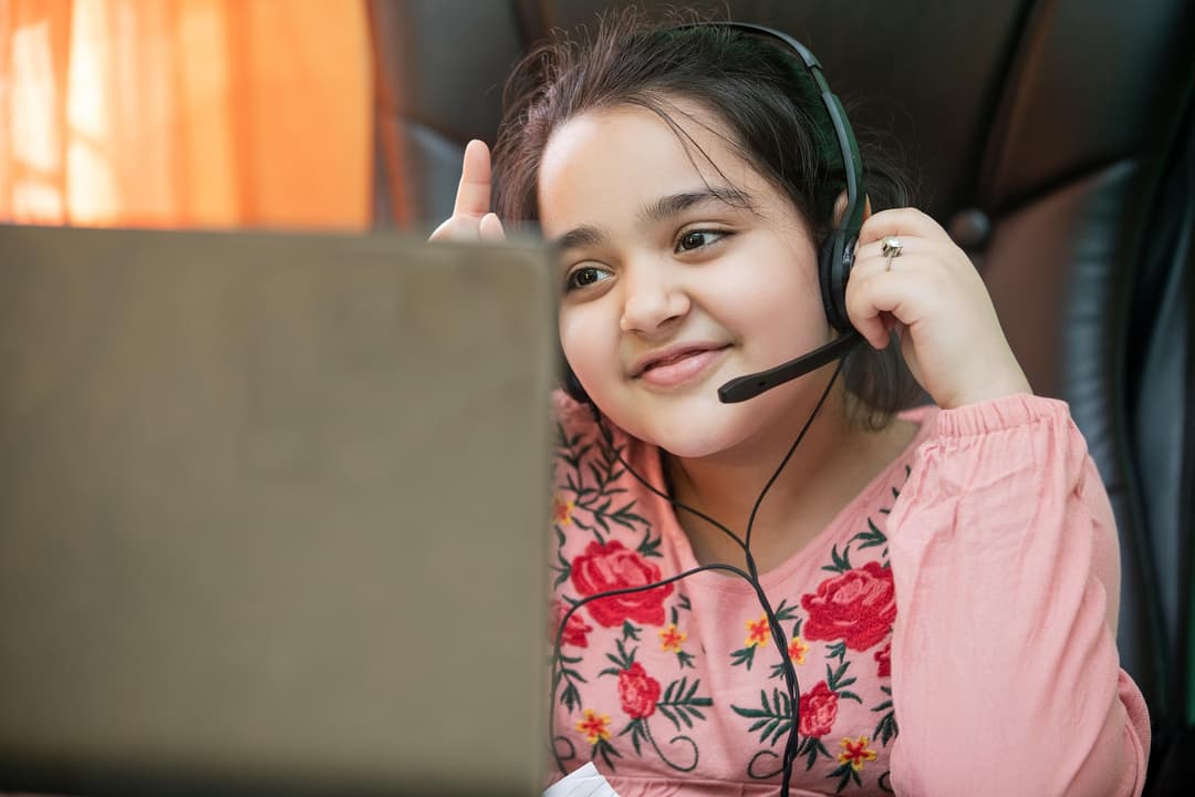 A child attending a zoom lesson